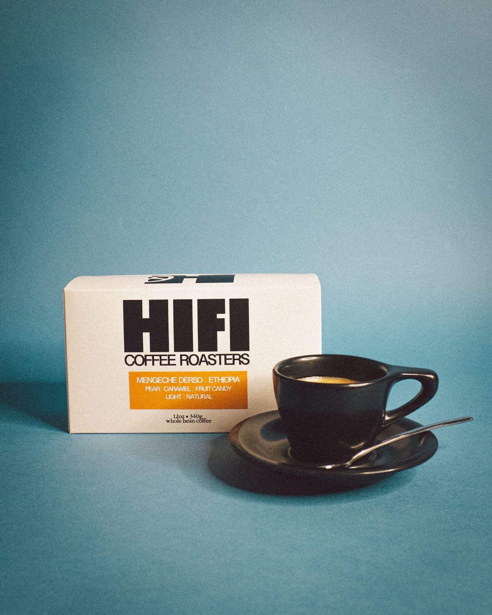 HIFI Coffee Roasters packaging with a black coffee cup and saucer on a blue background