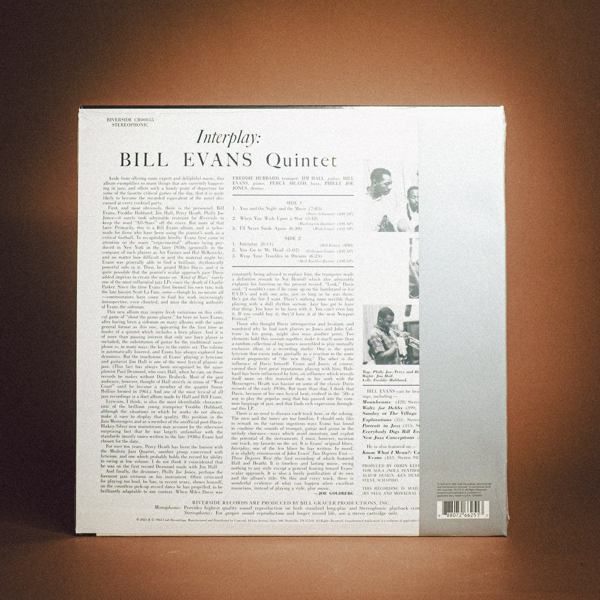 The back cover of a vinyl record sleeve for 'Interplay: Bill Evans Quintet' by Blue Note Records, displayed against a warm brown gradient background.